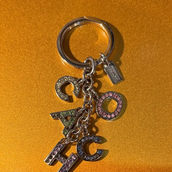 Coach Silver Keychain with Multicolor Letter Charms - Picture 1 of 3